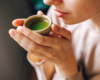 woman drinking matcha tea for oral health