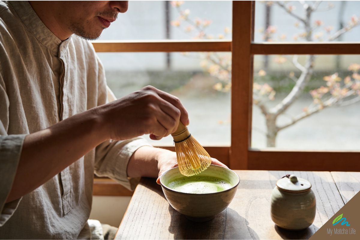 "Man whisking ceremonial matcha in the morning — mindful matcha ritual for calm focused energy"